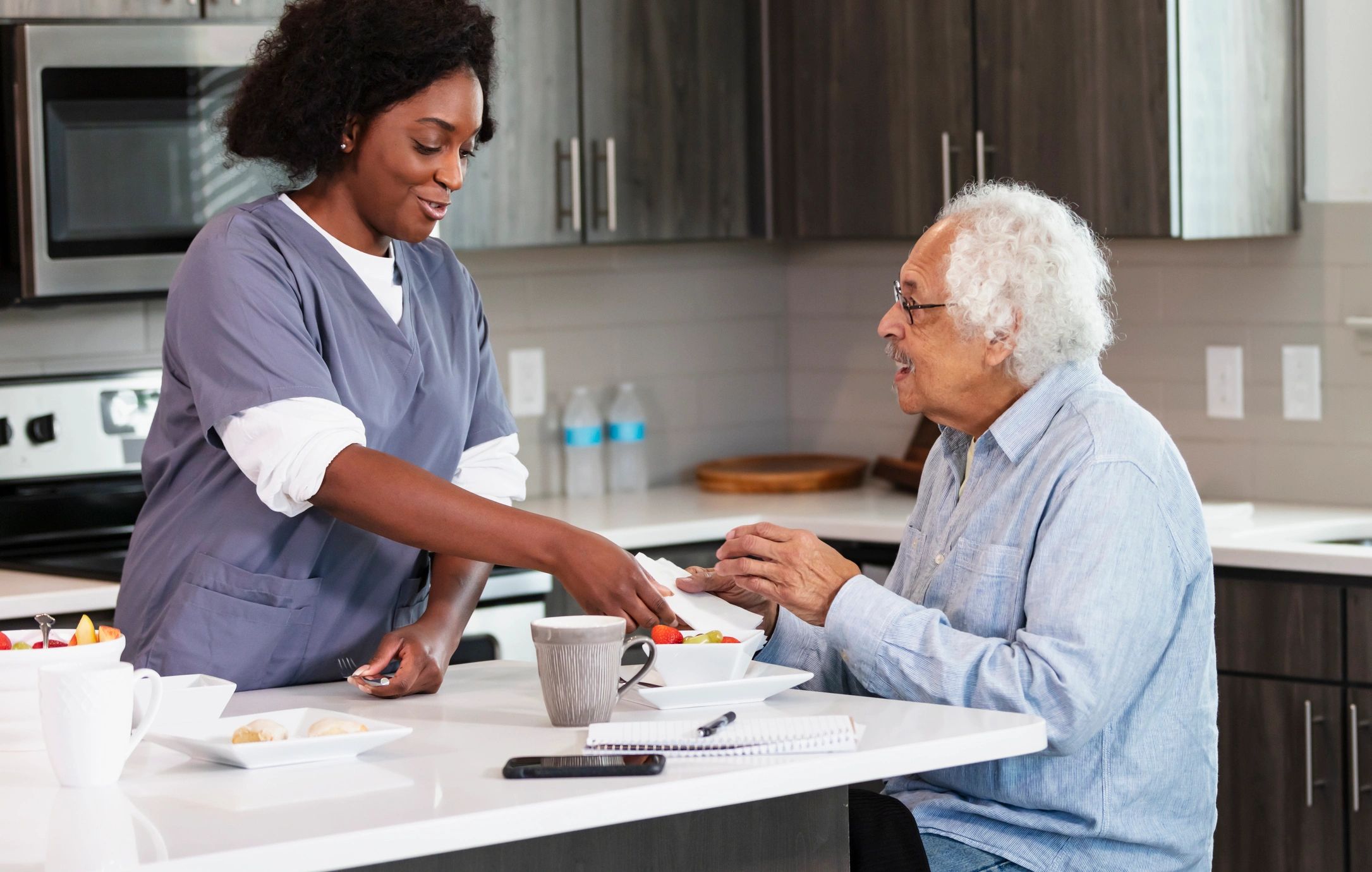 Caregiver assisting a senior at home